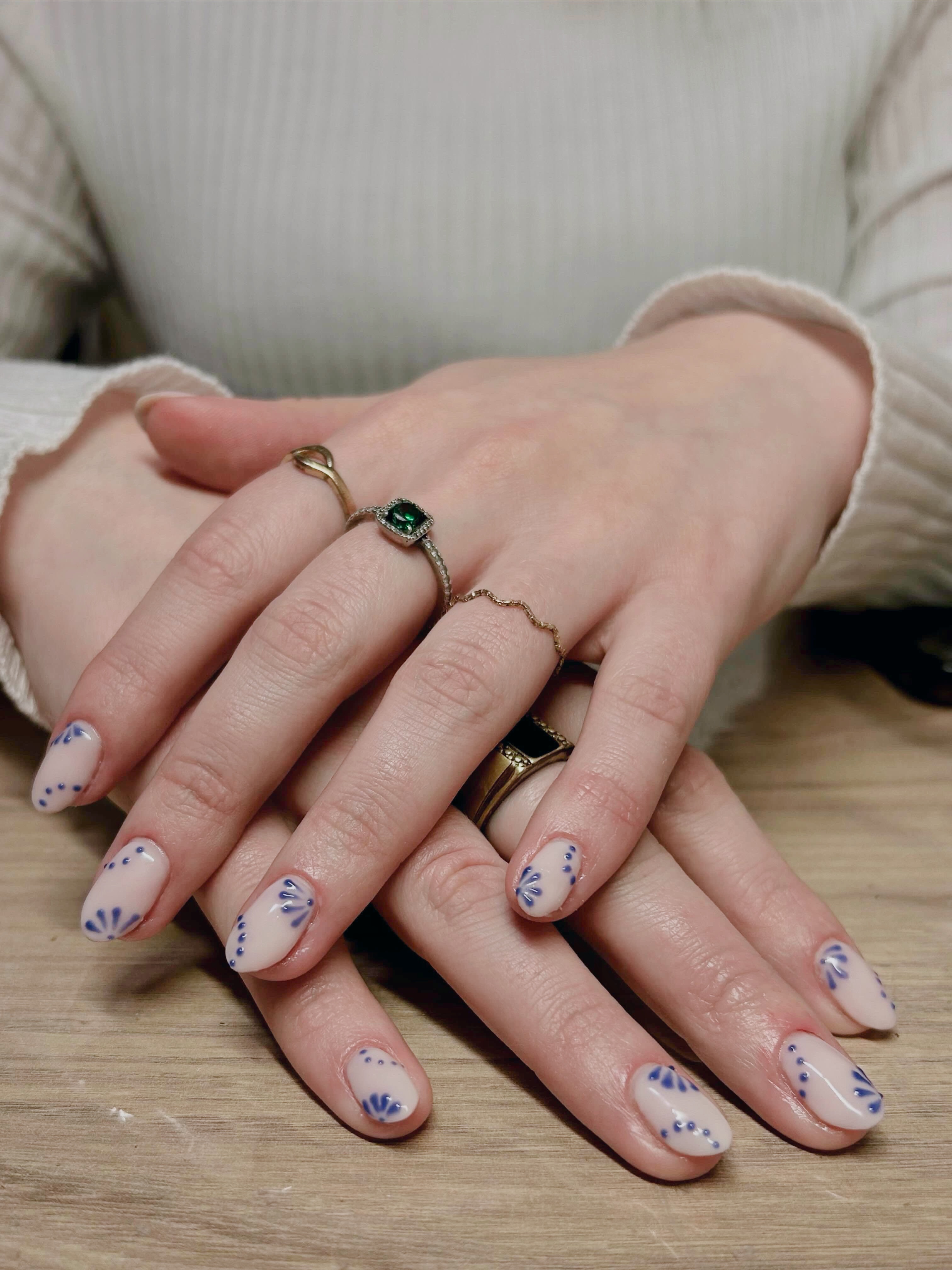 Milky white nails with navy floral art